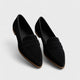 Women's black pointed-toe penny loafers with low heels
