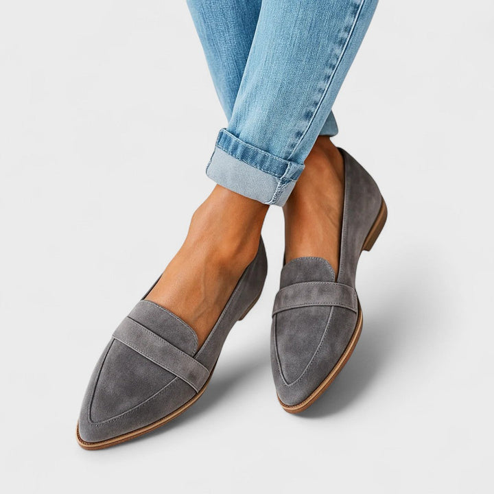 Women's black pointed-toe penny loafers with low heels