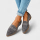 Women's black pointed-toe penny loafers with low heels