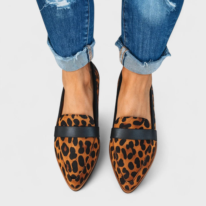 Women's black pointed-toe penny loafers with low heels