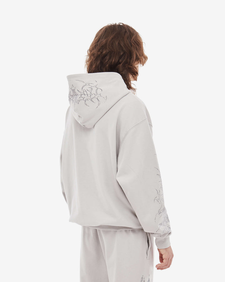 Light coloured zip up hoodie with cathedral graphic print and hood