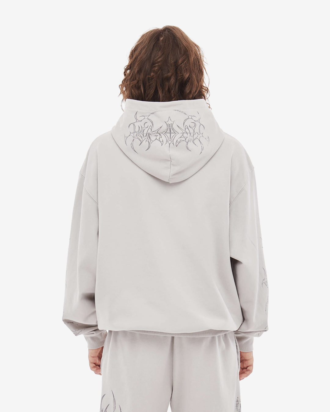 Light coloured zip up hoodie with cathedral graphic print and hood