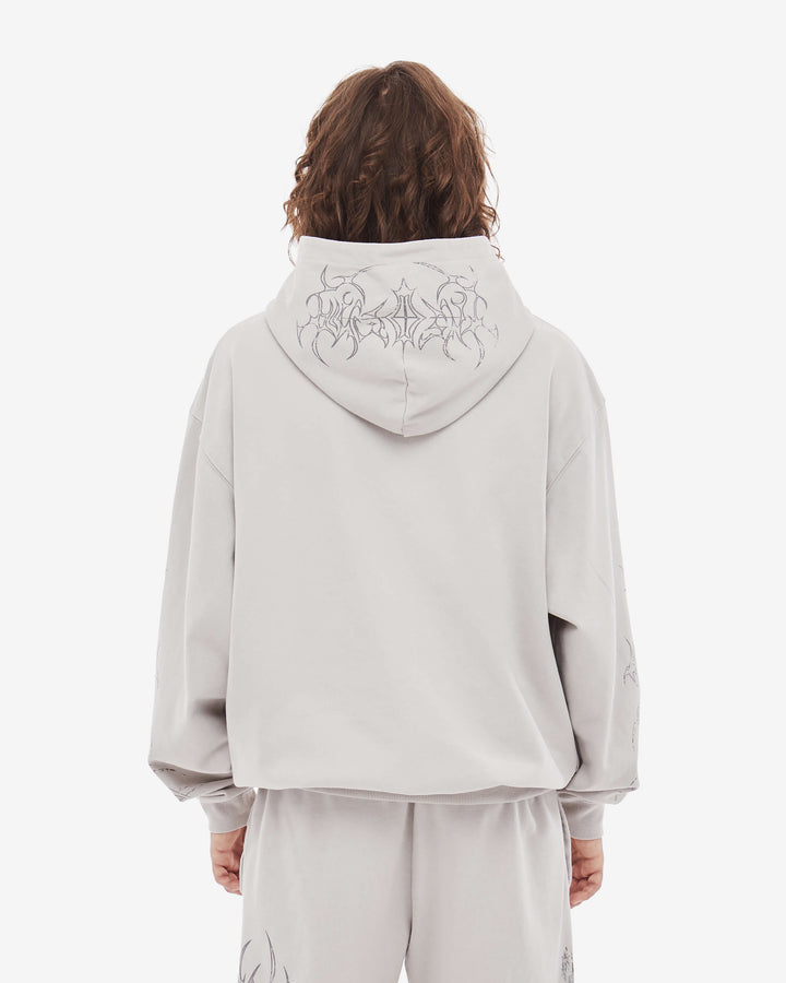 Light coloured zip up hoodie with cathedral graphic print and hood