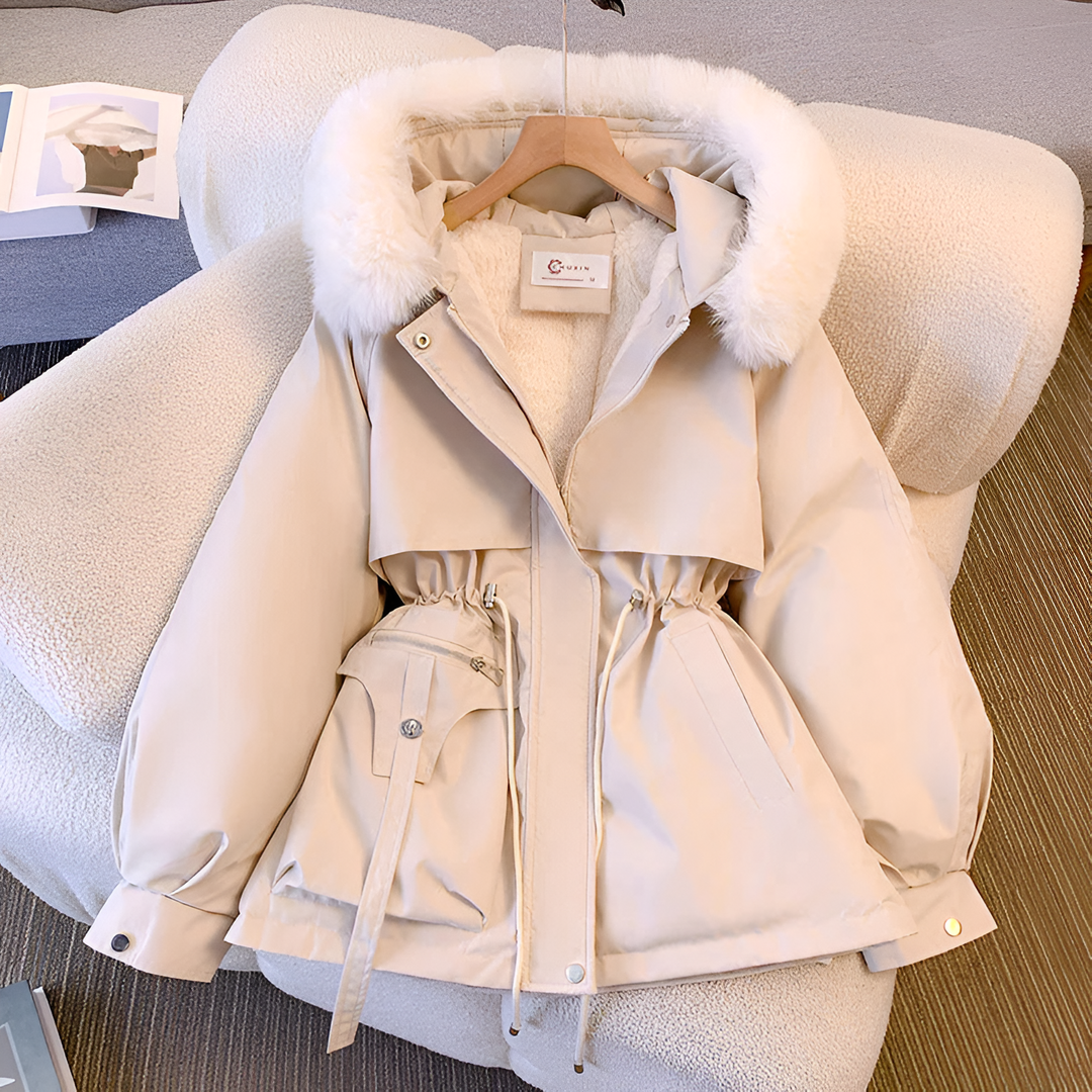 Women's hooded winter coat with fluffy trimmed hood and drawstring waist