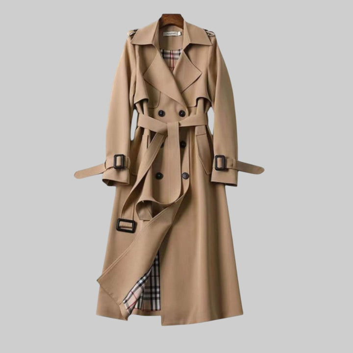 Women's long belted double-breasted trench coat with lapel collar and buckle cuffs