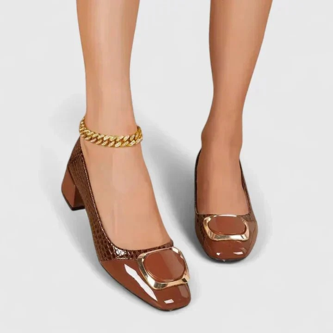 Women's embossed pointed-toe loafers with block heels and gold-tone ornament