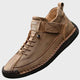 Orthopedic sneakers with white upper and beige sole, worn with jeans