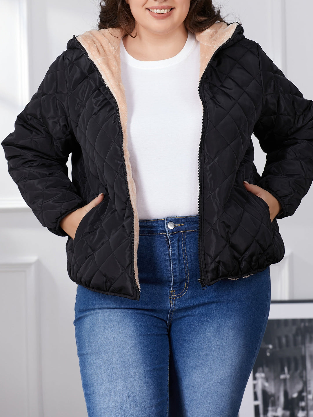 Women's plus size black quilted hooded jacket with zip front