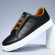Low-top panelled sneaker with lace-up front and flat sole