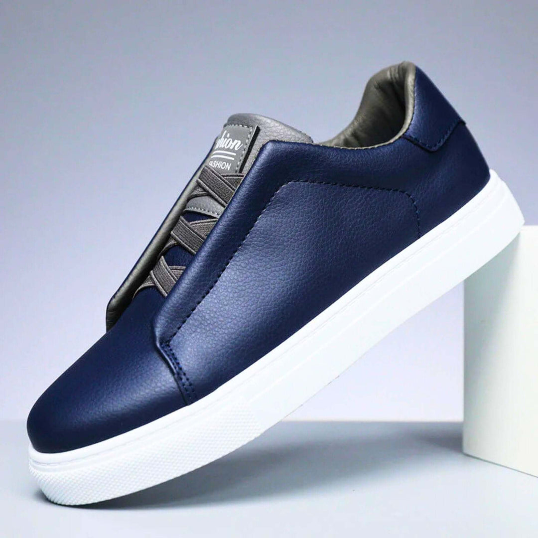 Low-top panelled sneaker with lace-up front and flat sole