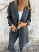 Women's longline button-front coat with lapel collar and long sleeves