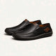 Men's slip-on moc toe loafers with stitched detailing and flat soles