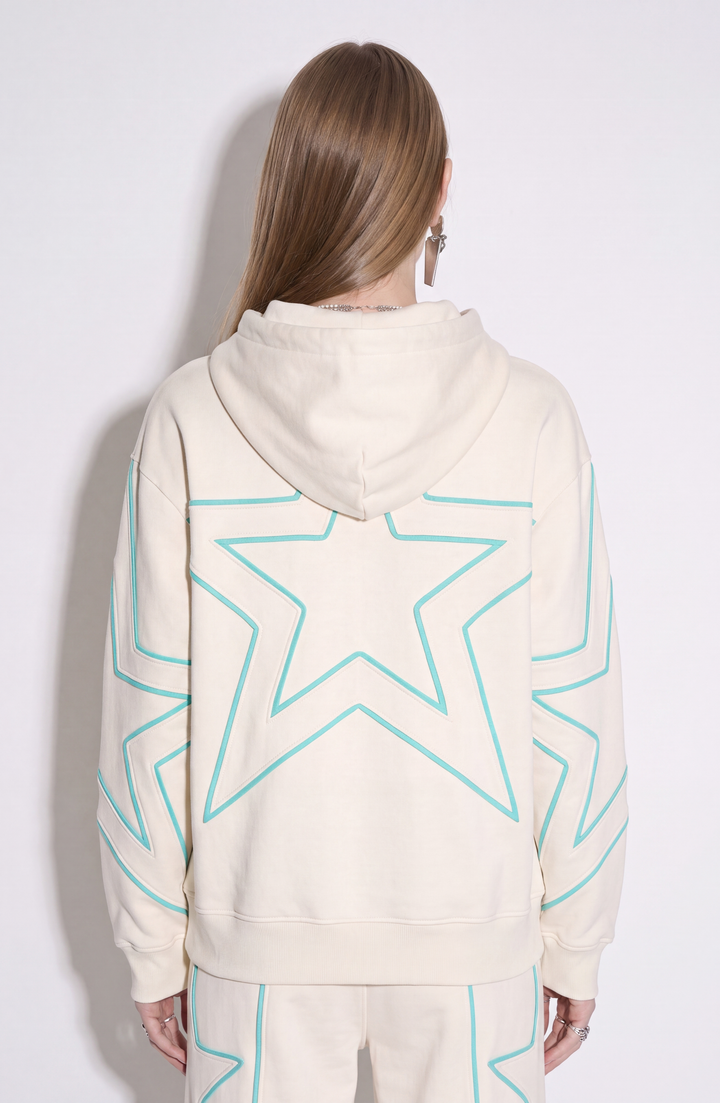 Cream hoodie with turquoise outlined star detailing, drawstring hood and kangaroo pocket
