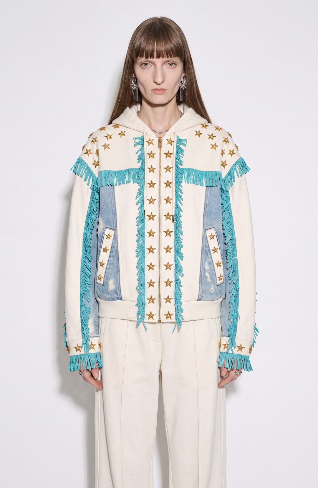 White hooded zip hoodie with gold stars, turquoise fringe and blue panels