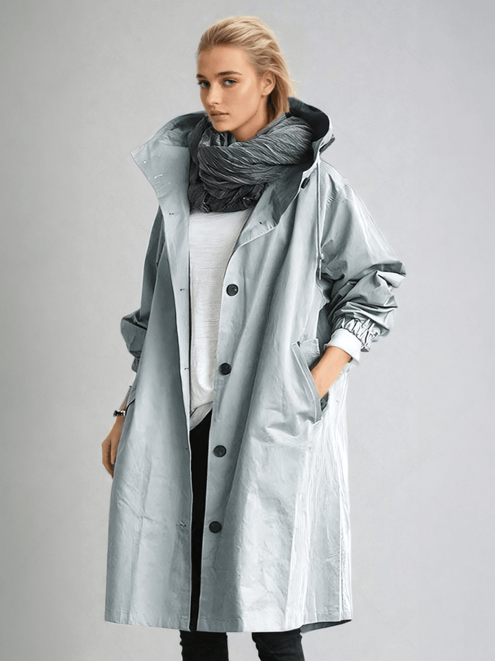 Women's hooded trench coat with buttons, long sleeves and side pockets