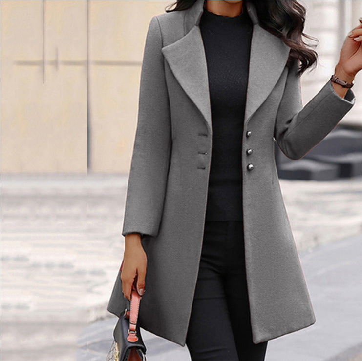 Women's long tailored coat with notched lapels and button front
