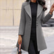 Women's long tailored coat with notched lapels and button front