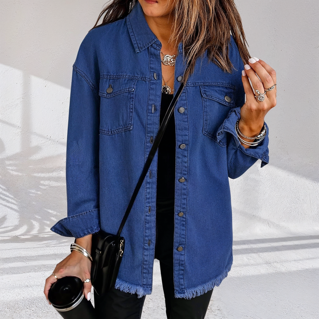 Women's oversized denim jacket with chest pockets and frayed hem