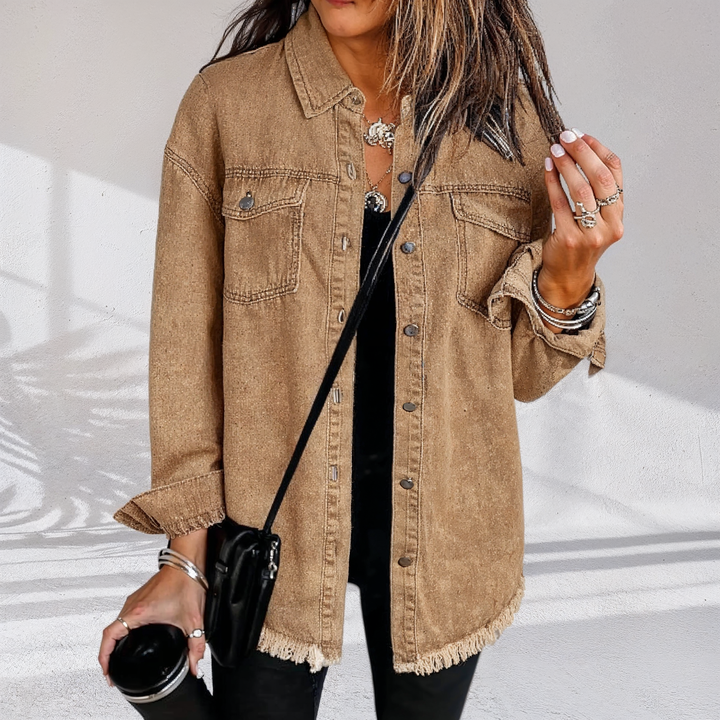 Women's oversized denim jacket with chest pockets and frayed hem