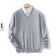 Men's long-sleeve V-neck sweater layered over a collared shirt