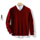 Men's long-sleeve V-neck sweater layered over a collared shirt