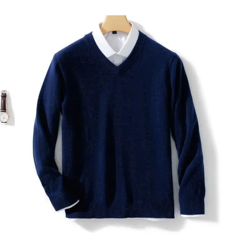 Men's long-sleeve V-neck sweater layered over a collared shirt