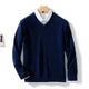Men's long-sleeve V-neck sweater layered over a collared shirt