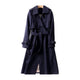 Women's long belted trench coat with double-breasted buttons and cuff buckles
