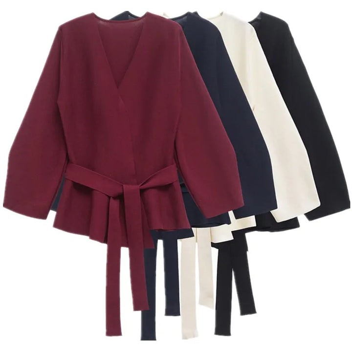 Women's long-sleeve wrap knit top with V-neckline and tie waist