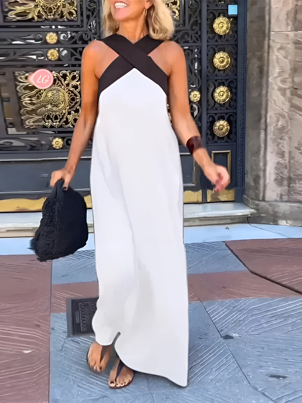 Women's sleeveless maxi dress with crossed halter neckline in black and white colourway