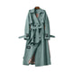 Women's long belted trench coat with double-breasted buttons and cuff buckles