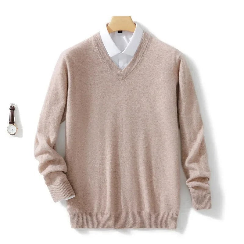 Men's long-sleeve V-neck sweater layered over a collared shirt