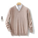 Men's long-sleeve V-neck sweater layered over a collared shirt