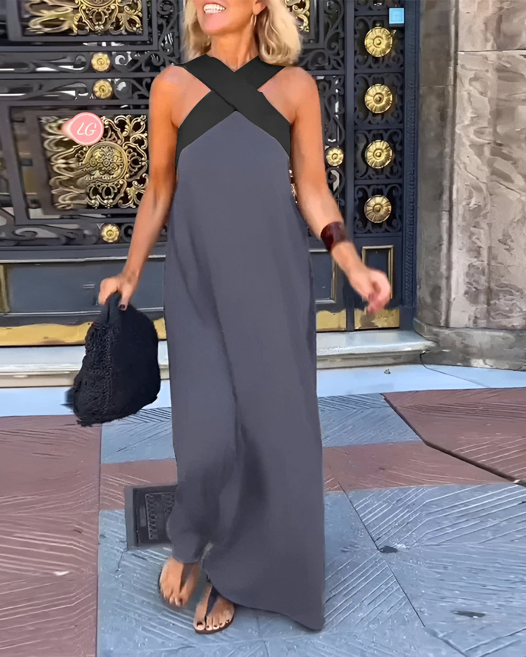 Women's sleeveless maxi dress with crossed halter neckline in black and white colourway