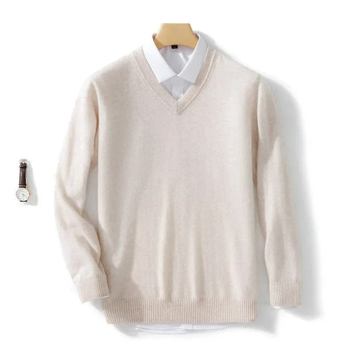Men's long-sleeve V-neck sweater layered over a collared shirt