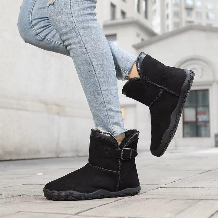 Winter ankle boots with buckle strap faux fur trim and treaded sole