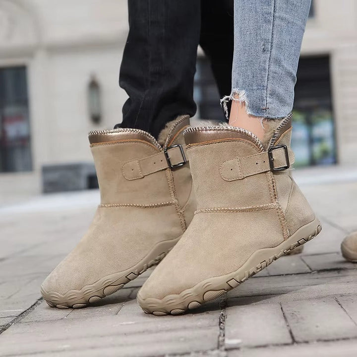 Winter ankle boots with buckle strap faux fur trim and treaded sole