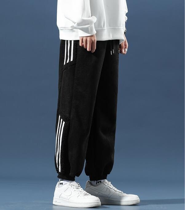 Fleece jogger pants with striped side panels and elasticated cuffs