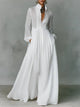 Women's maxi shirt dress with stand collar and long sleeves in white with pleated skirt