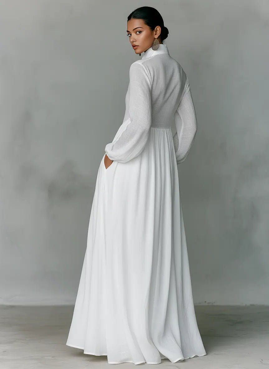 Women's maxi shirt dress with stand collar and long sleeves in white with pleated skirt