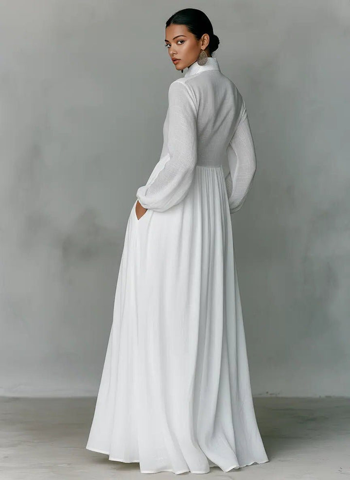 Women's maxi shirt dress with stand collar and long sleeves in white with pleated skirt