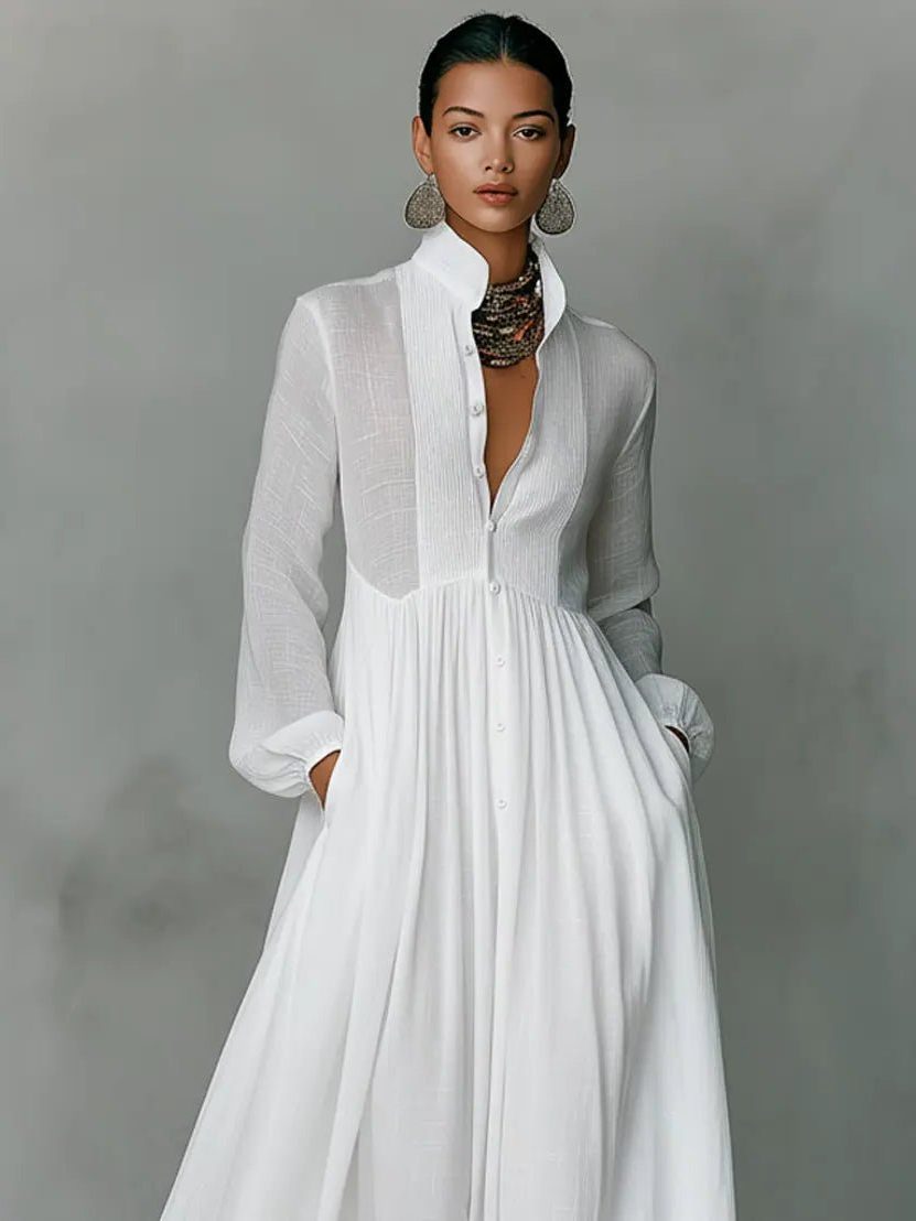 Women's maxi shirt dress with stand collar and long sleeves in white with pleated skirt