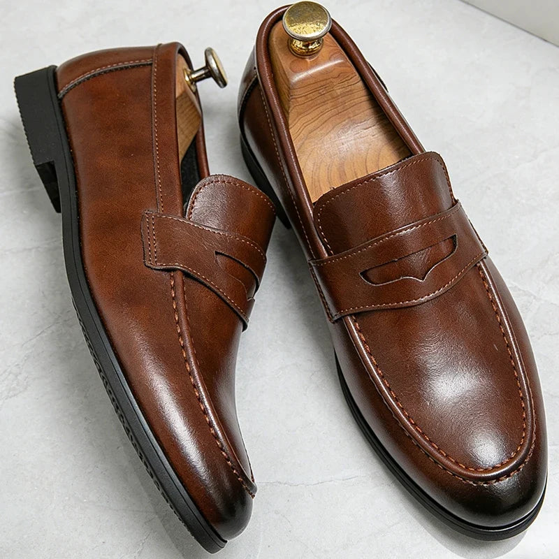 Men's penny loafers with rounded moc toes, strap details and low soles