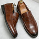 Men's penny loafers with rounded moc toes, strap details and low soles