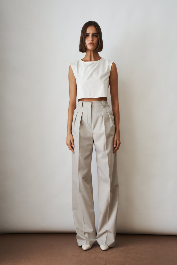 Women's beige high-rise wide-leg pants with front pleats and side pockets