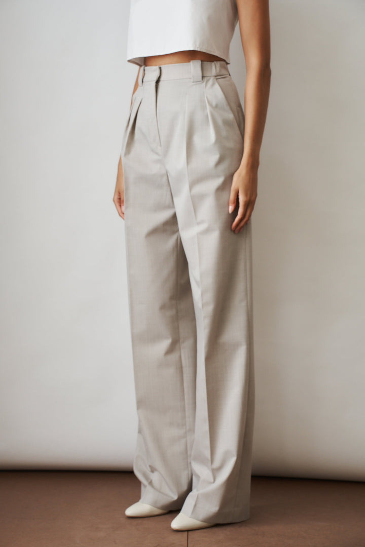 Women's beige high-rise wide-leg pants with front pleats and side pockets