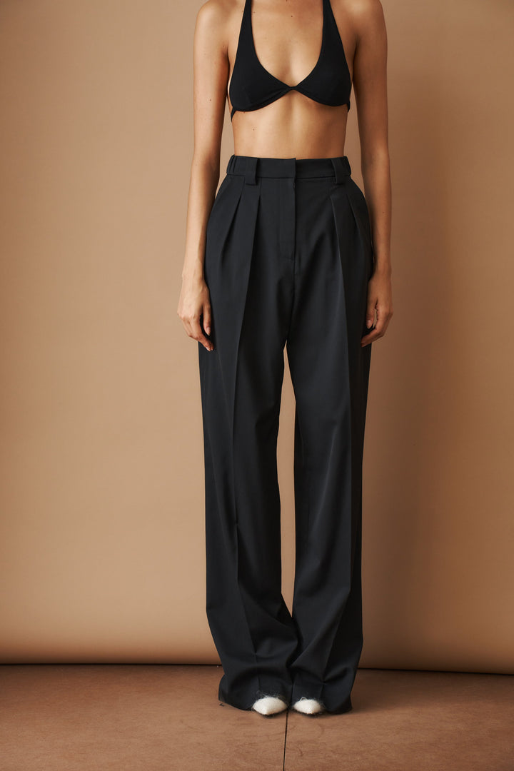 Women's black high-waisted pleated wide-leg pants with belt loops