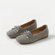 Women's perforated loafers with decorative bows and flat segmented soles