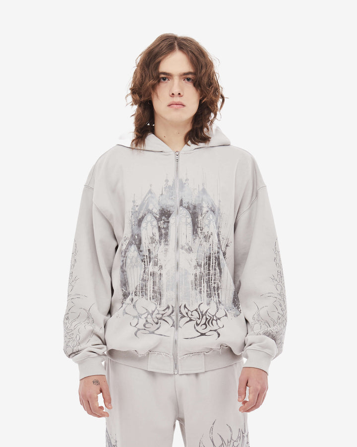 Light coloured zip up hoodie with cathedral graphic print and hood