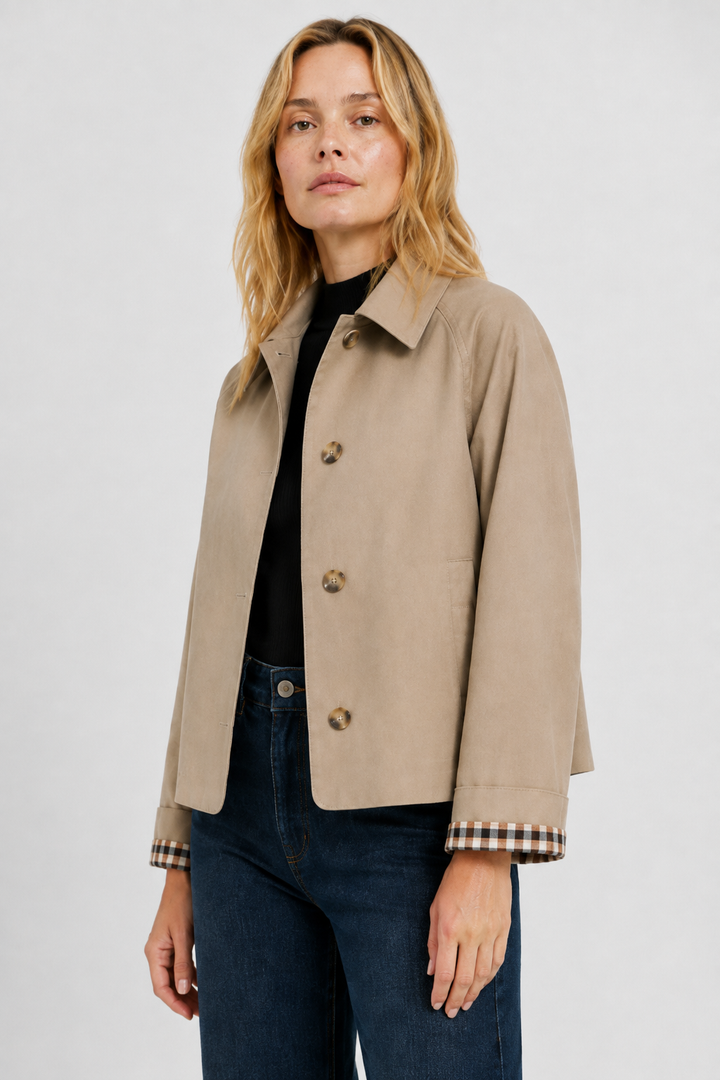 Women's trench jacket with pointed collar, button front and checked cuff lining